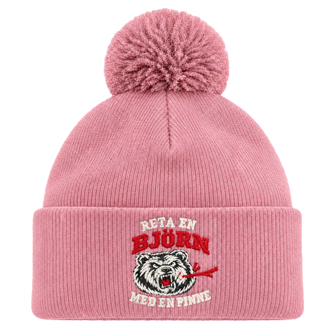 Reta en björn med en pinne – Rosa Pom Pom Beanie