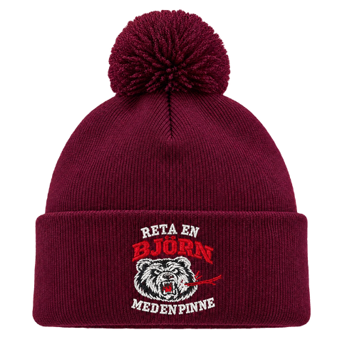 Reta en björn med en pinne – Vinröd Pom Pom Beanie